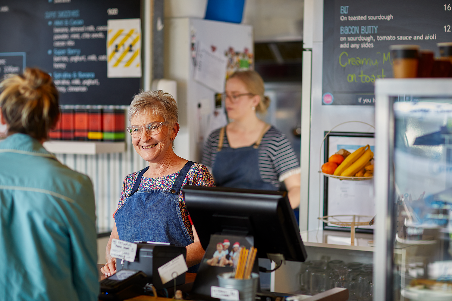 A hospitality worker serving a customer 